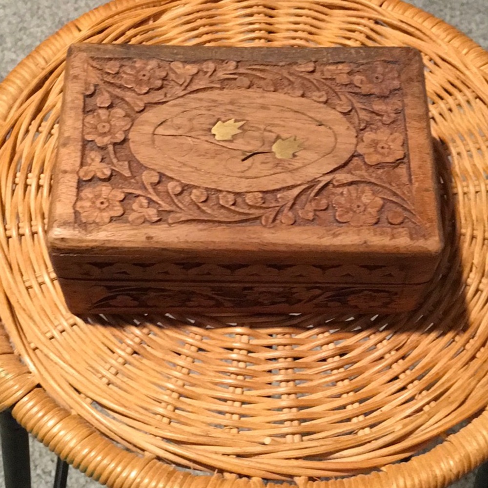 Wooden jewelry box with copper metal design on top